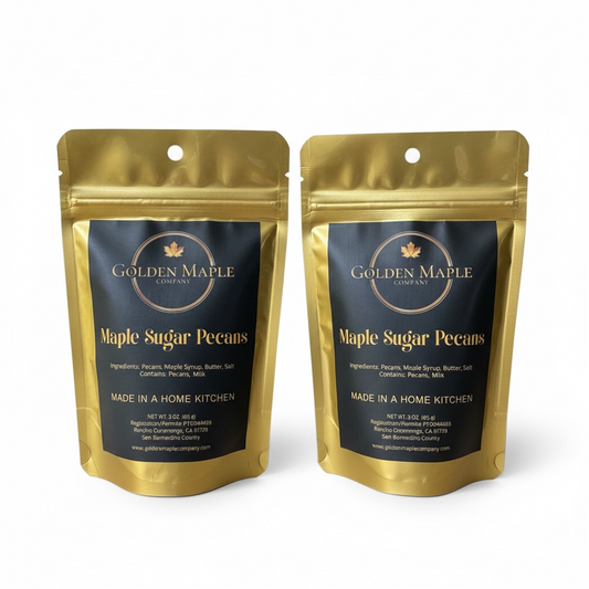 Two packages of Golden Maple Company Maple Sugar Pecans on a white background