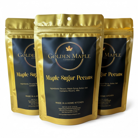 Three packages of Golden Maple Company Maple Sugar Pecans on a white background