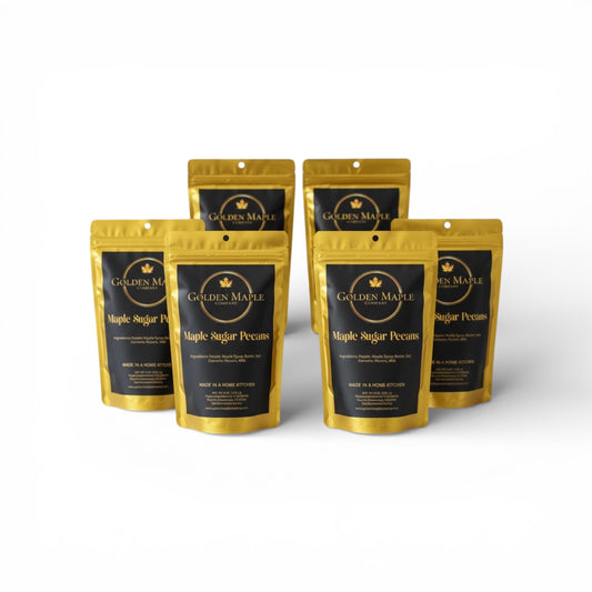 Six packages of Golden Maple Sugar Pecans on a white background