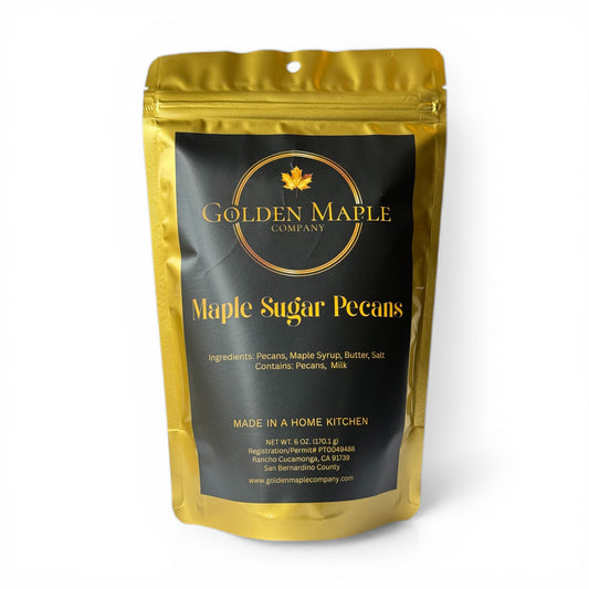 Gold and black packaging of Golden Maple Company Maple Sugar Pecans on a white background